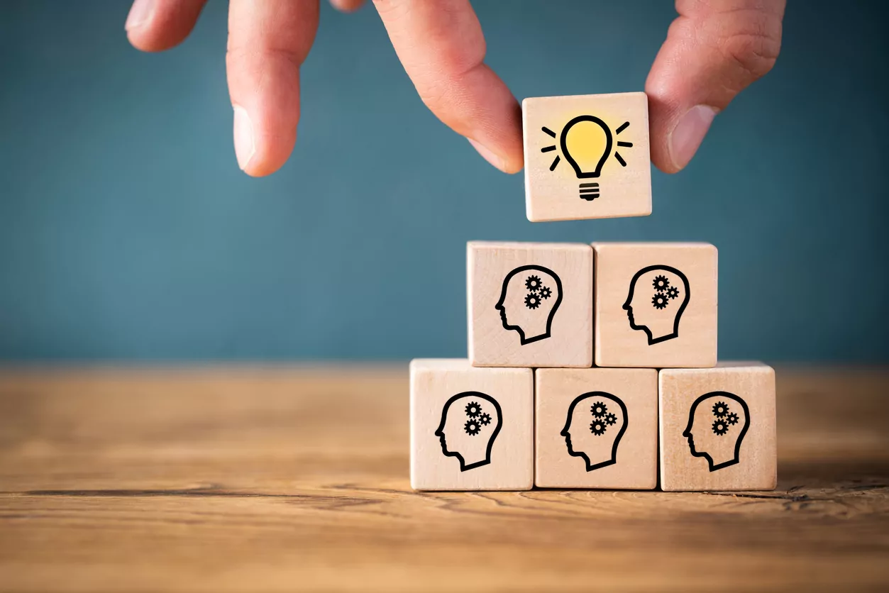 Wooden blocks stacked into a knowledge management system formation